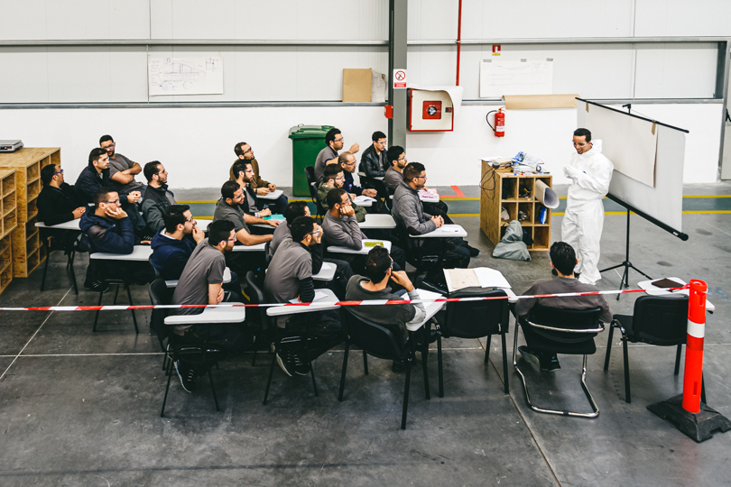 Teacher and apprentices during theoretical training