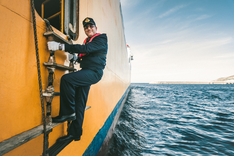 Portrait of Maritime Captain boarding ferry at Med Port entrance